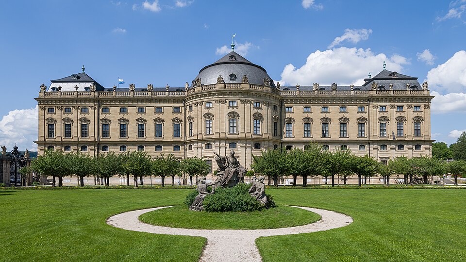 The long Baroque south facade of the Würzburg Residence and its garden.